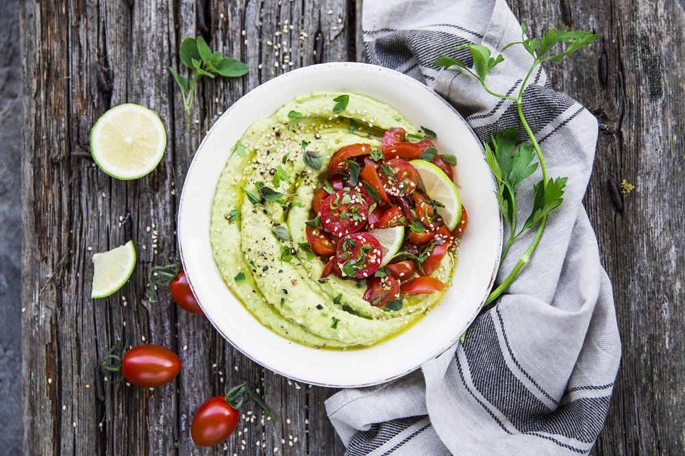 Avocado hummus with tomato salad
